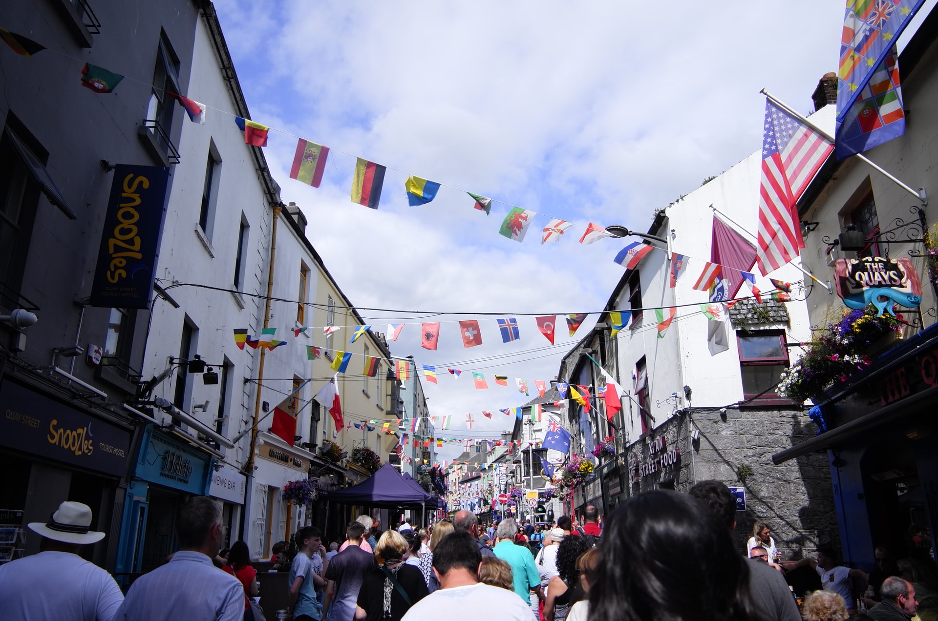 Image of Quay Street on a busy day with a crowd of people