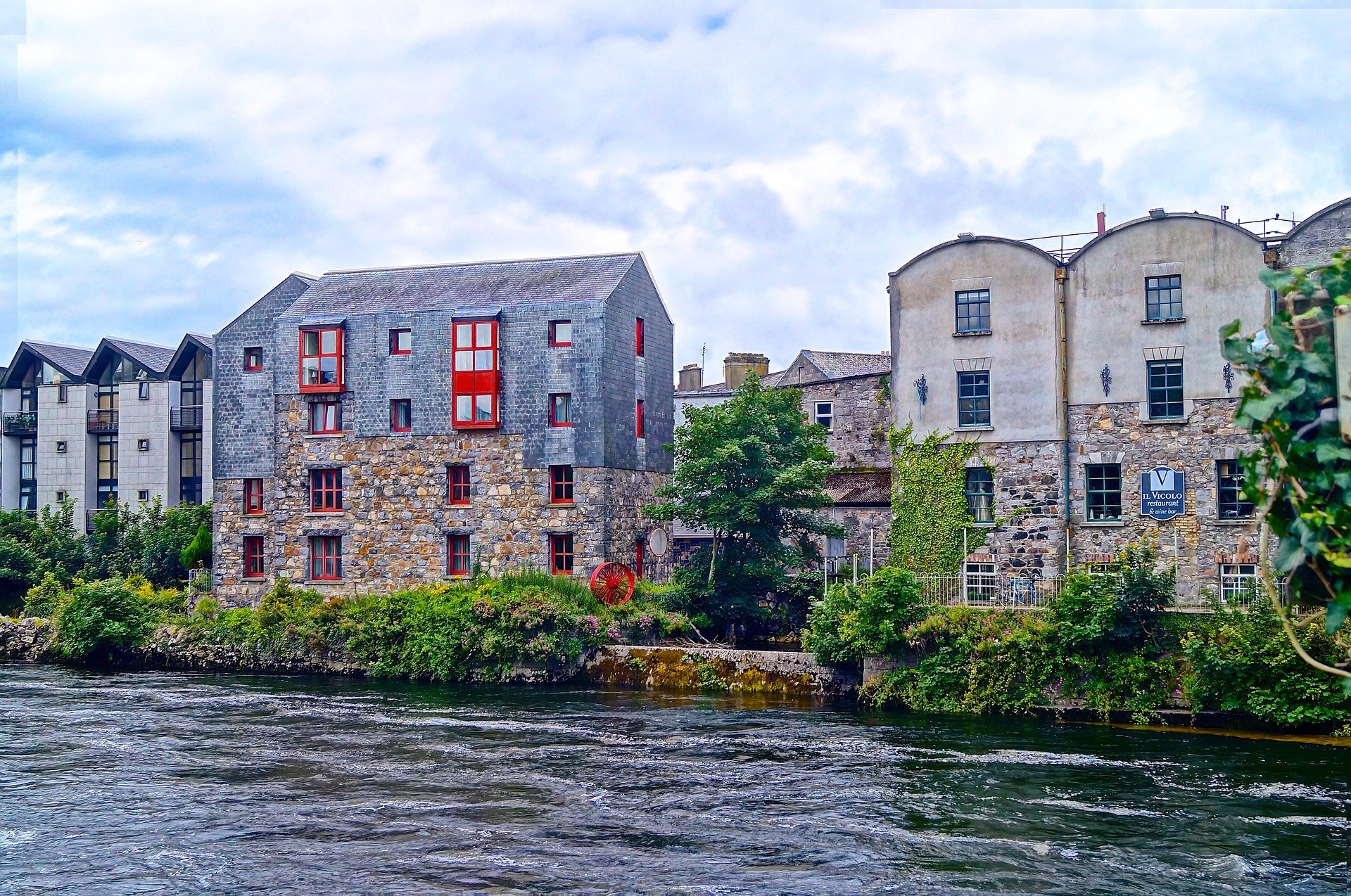 Galway canal overlooking two bulidings