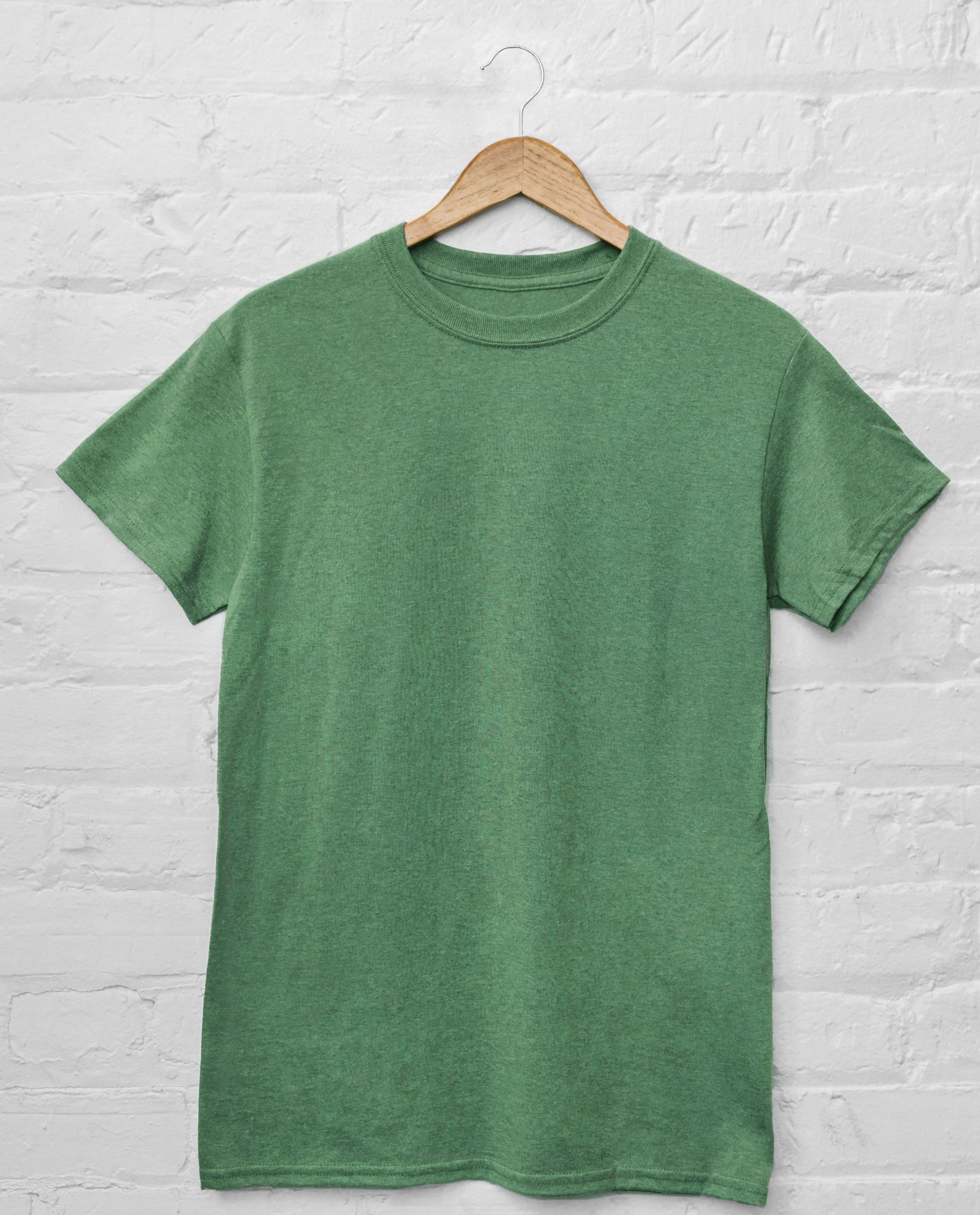 Green t-shirt on a hanger